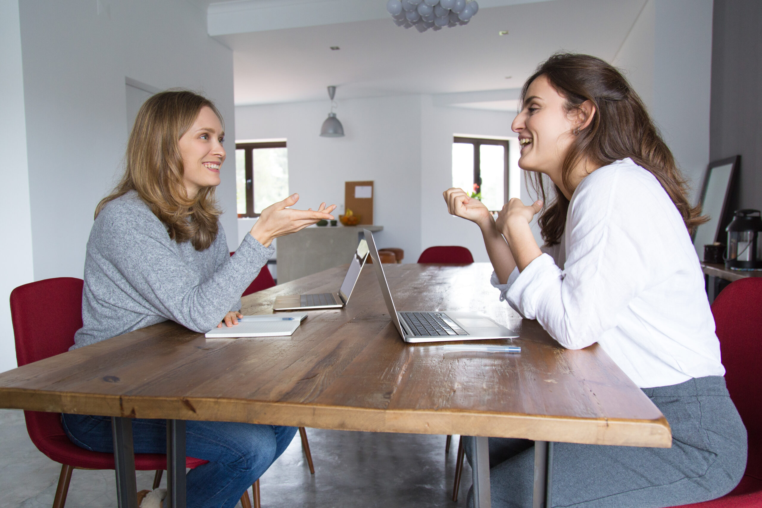 Young woman and her tutor during one of their face-to-face Dutch lessons at home.