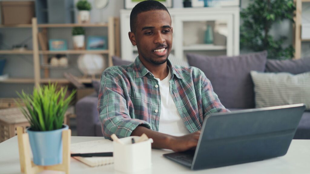 Man taking online Dutch lessons on his laptop