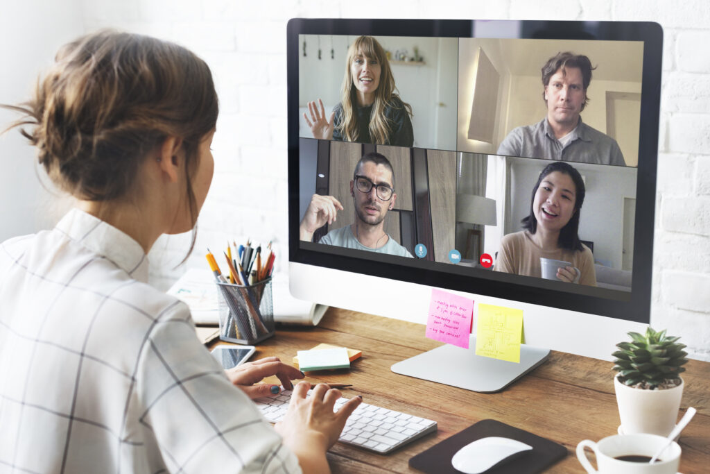 Young woman following an online Dutch group course from home