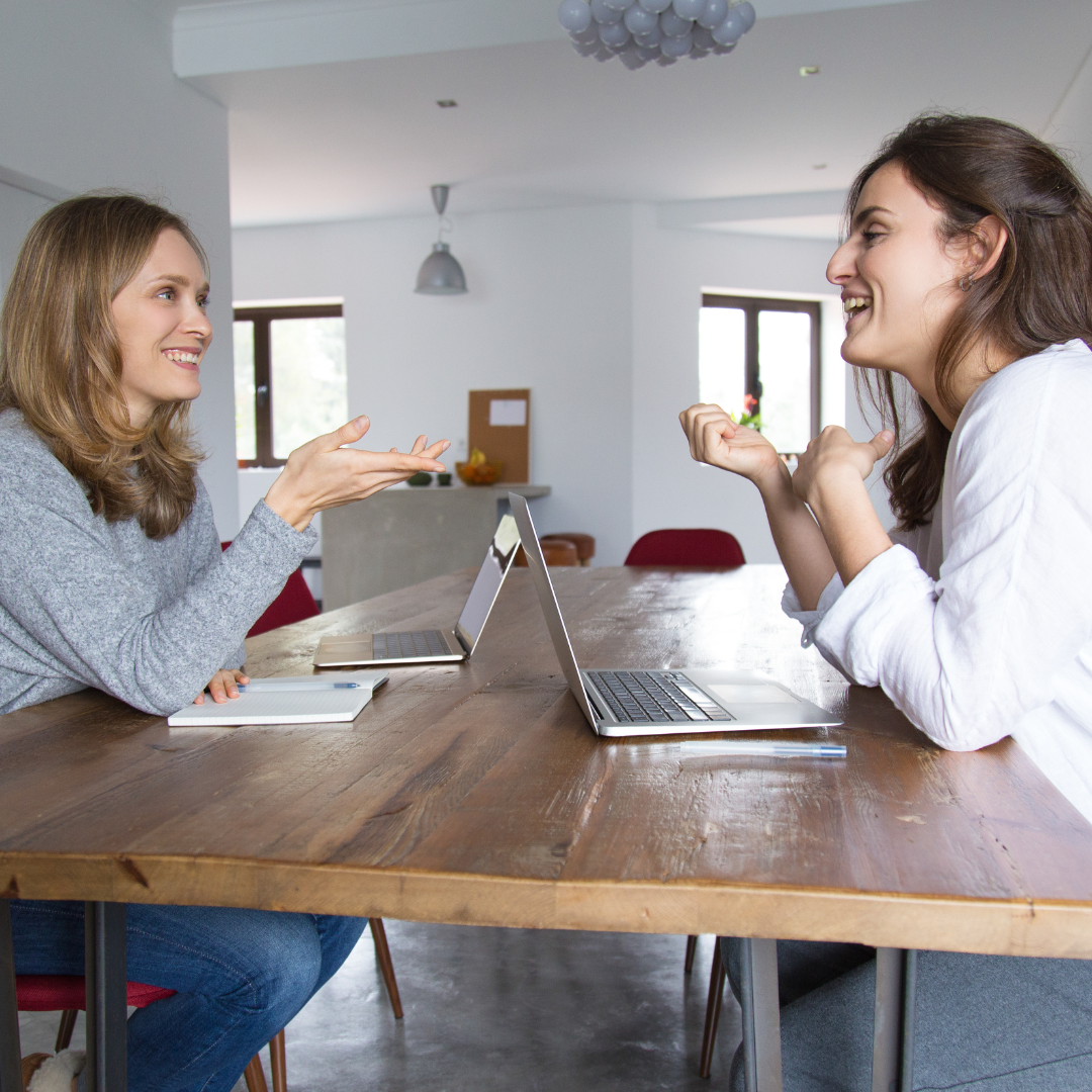 Young woman and her tutor during one of their face-to-face Dutch lessons at home.