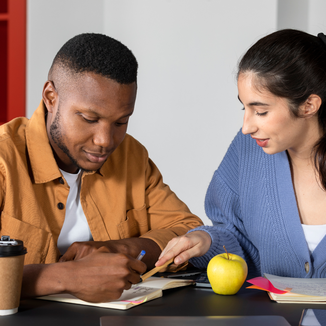 Young man and his female tutor during one of their Dutch lessons in Amsterdam.