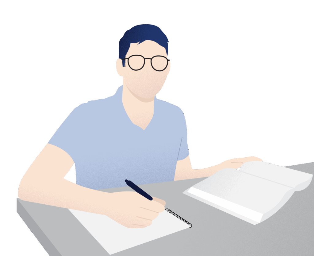 Male student wearing glasses takes notes while having an open textbook in front of him.